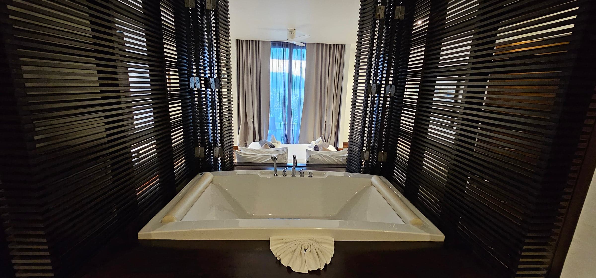 Freestanding bathtub in luxurious marble bathroom