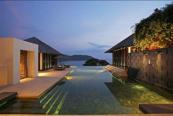 Villa infinity pool illuminated at night