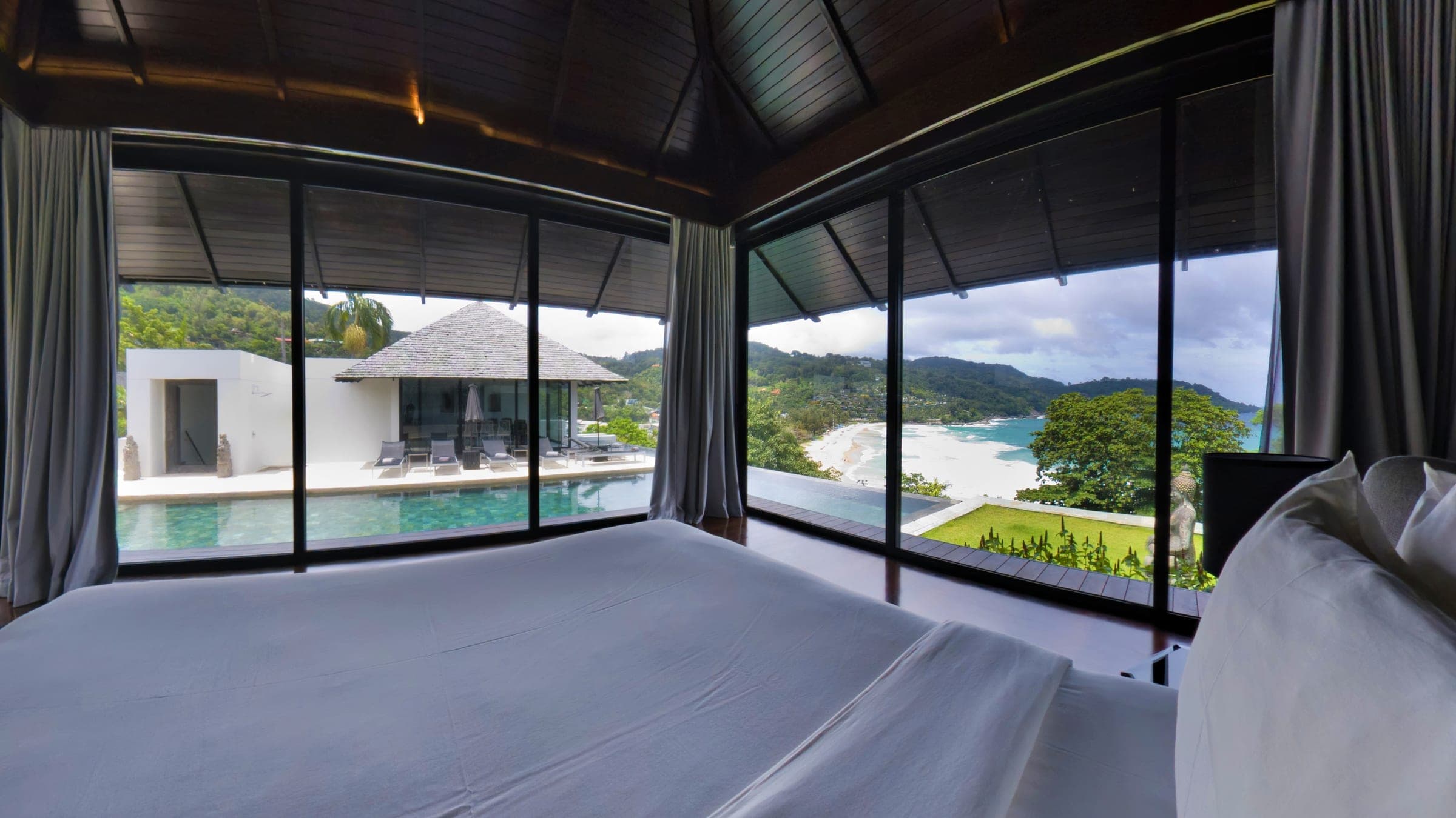 Master bedroom with view over the infinity pool and Kata Noi bay